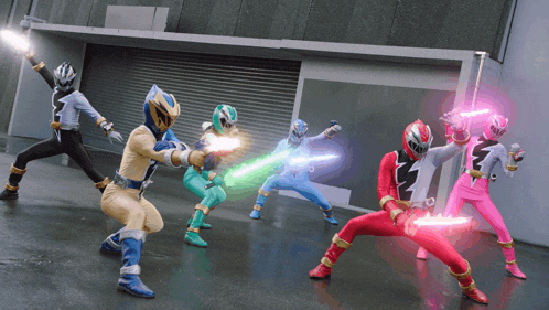 a group of power rangers are holding glowing swords in their hands