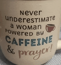 a mug that says " never underestimate a woman powered by caffeine and prayer "