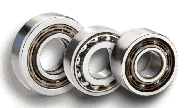 three bearings are lined up on a white surface