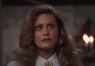 a close up of a man wearing a santa hat .