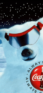 an advertisement for coca cola shows a polar bear wearing goggles in the snow