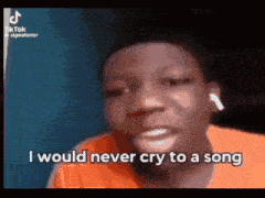 a young man is crying while wearing ear buds and says `` i would never cry to a song '' .