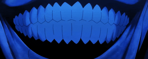 a close up of a person 's teeth with a blue background