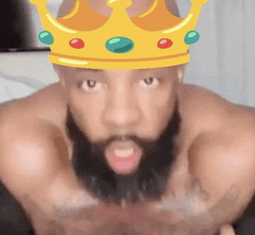 a man with a beard is wearing a crown over his head