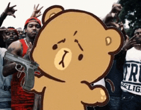 a cartoon teddy bear is holding a gun in front of a group of men .