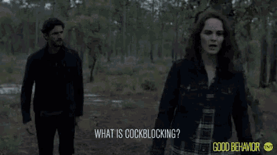 a man and a woman are walking through a forest and the woman is asking what is cockblocking