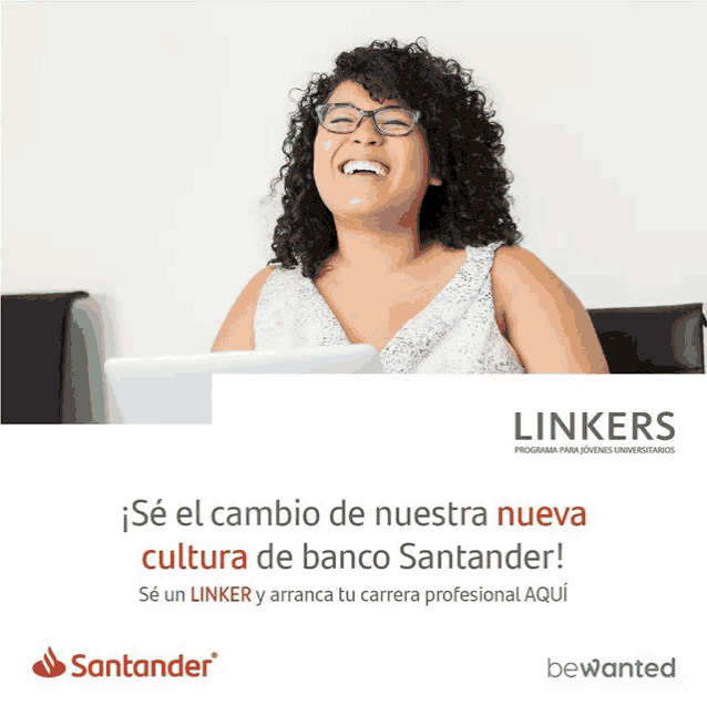 a woman sitting in front of a laptop with a santander logo on the bottom right