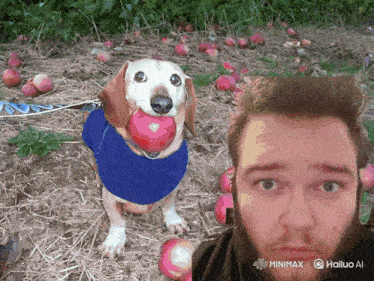 a dog with a red ball in its mouth is next to a man with a beard