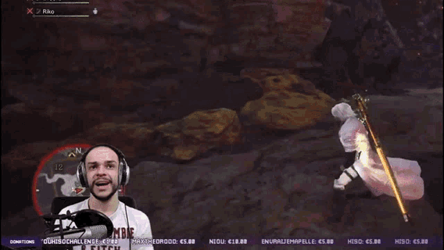 a man wearing headphones and a shirt that says ' ombe ' on it