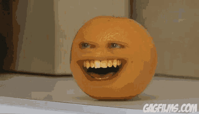 an orange with a face on it and the website gagfilms.com in the bottom right corner