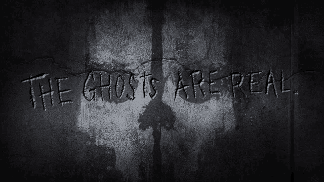 the ghosts are real written on a wall with a shadow