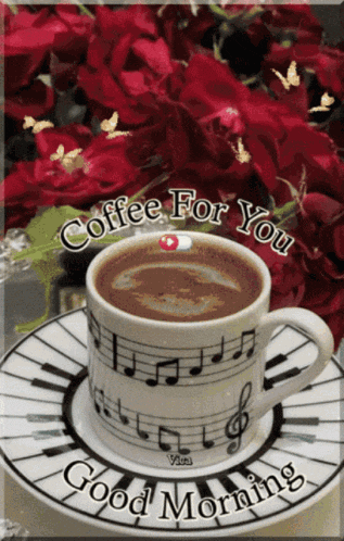 a cup of coffee sits on a saucer that says good morning