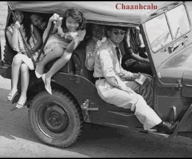 a black and white photo of a group of people in a jeep with chaanhcalu written on the bottom right