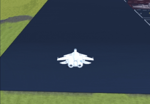 a white plane is sitting on top of a blue surface