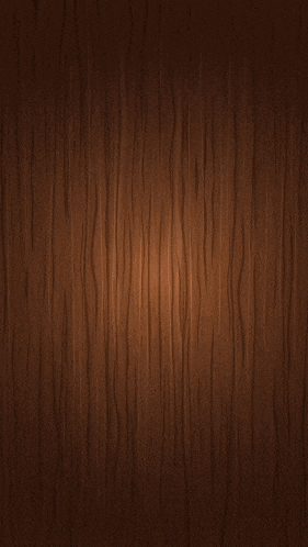 a close up of a wooden surface with a blurred background .