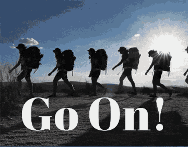 a group of people with backpacks are walking down a dirt road with the words go on in white letters