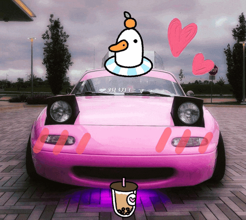 a pink car with a duck on top and a cup of tea