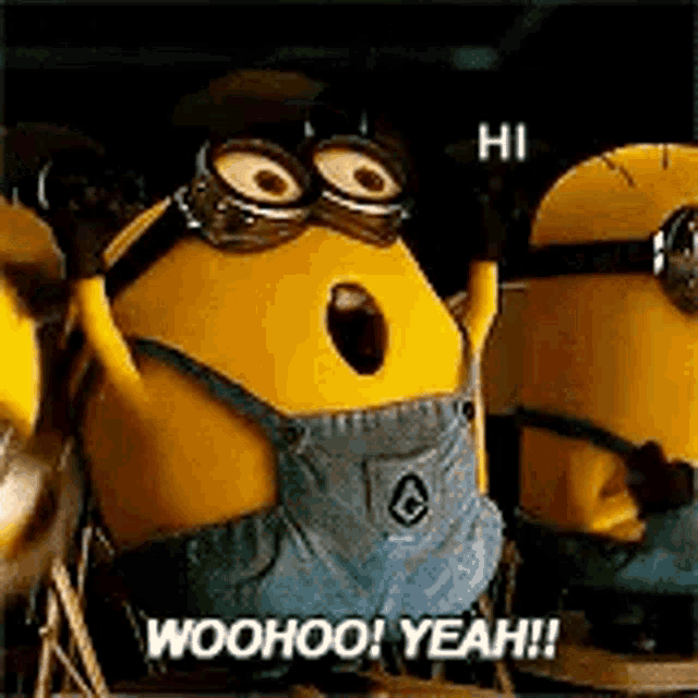 a group of minions are standing next to each other and one of them is wearing goggles and overalls .