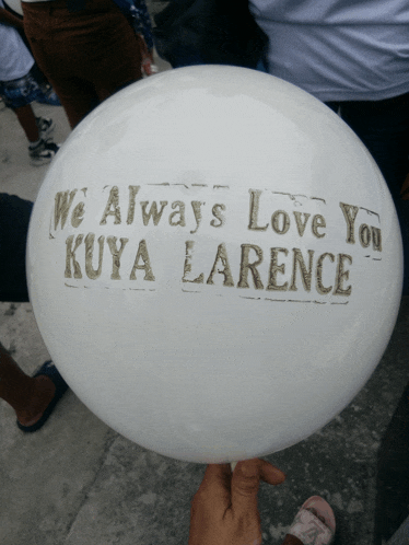 a white balloon that says we always love you kuya lorence