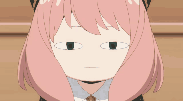 a close up of a pink haired anime character making a face