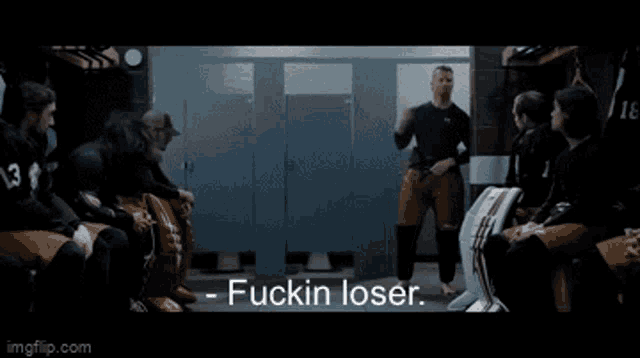 a group of people sitting in a locker room with the words fuckin loser on the bottom right
