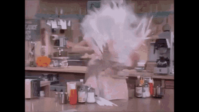 a person is standing in front of a counter in a restaurant with a lot of smoke coming out of their head .