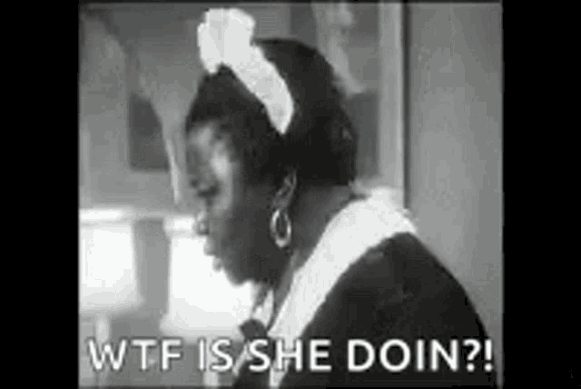 a black and white photo of a maid saying wtf is she doin .