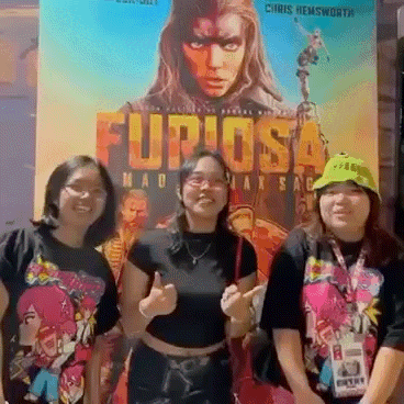 three women are posing in front of a movie poster that says furiosa