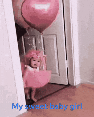 a little girl in a pink dress is holding a pink heart shaped balloon and says my sweet baby girl