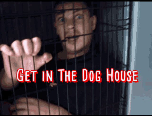 a man in a cage with the words " get in the dog house " above him