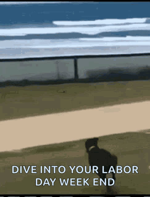 a man is walking down a dirt road with the words " dive into your labor day week end "