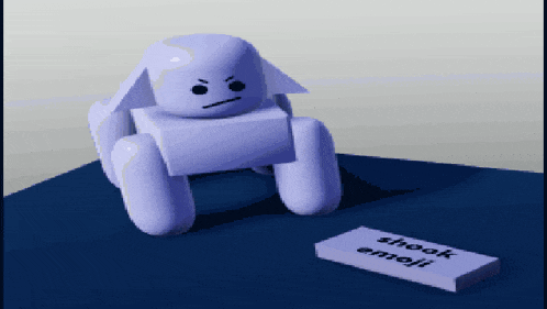 a purple toy is sitting next to a piece of paper that says shook emoji