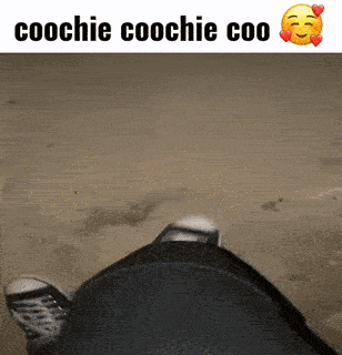 a picture of a person 's feet with the words coochie coochie coo below it