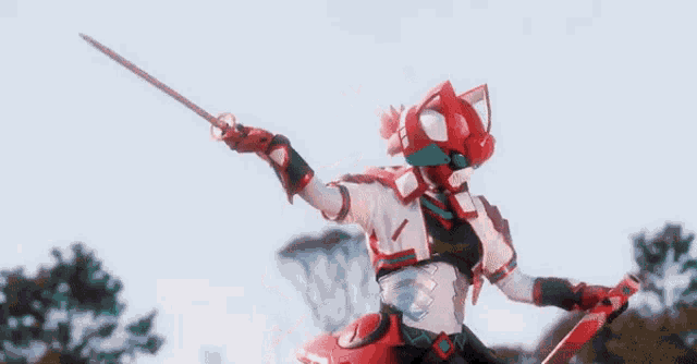 a woman in a red and white robot costume is standing in front of trees .