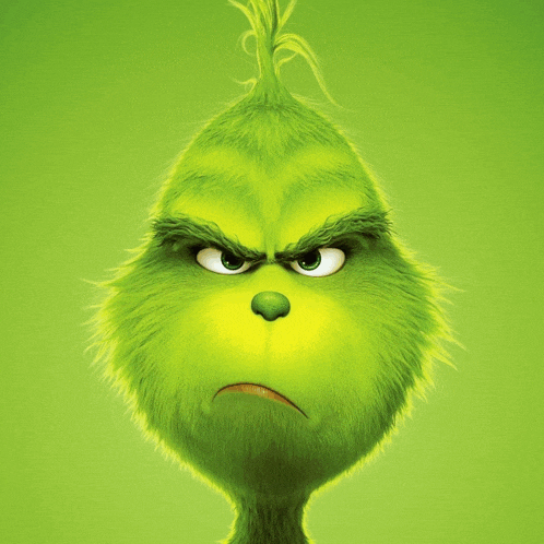 a close up of the grinch 's face with an angry look on his face