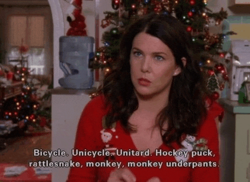 a woman in a red sweater says bicycle unicycle unitard hockey puck rattlesnakes monkey monkey underpants