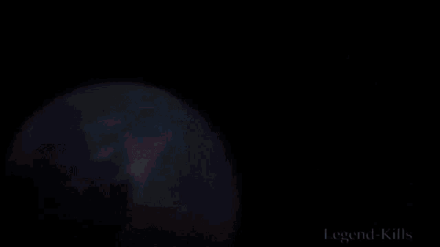 a man is standing in front of a globe in space .