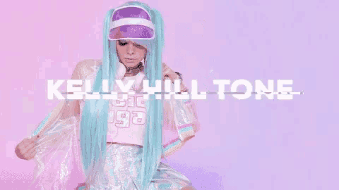 a woman with long blue hair and a purple visor is wearing a kelly hill tone costume .