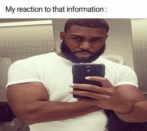 a man is taking a selfie in a bathroom with the caption " my reaction to that information "