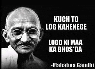 a black and white photo of mahatma gandhi with glasses and a quote from him .