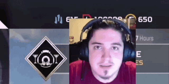 a man wearing headphones is playing a video game called iqy