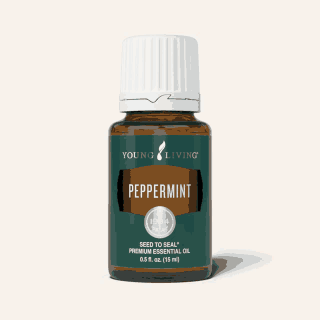 a bottle of young living peppermint essential oil on a white background