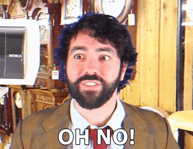 a man with a beard and tie is saying oh no