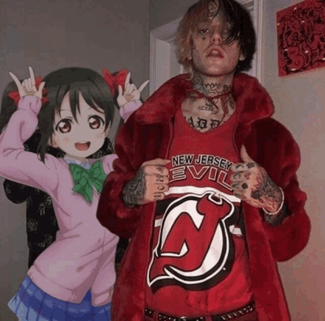 a man wearing a new jersey devils shirt stands next to a girl