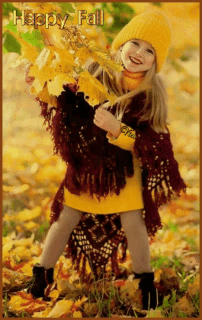 a little girl in a yellow hat is holding a bunch of leaves with the words happy fall written above her