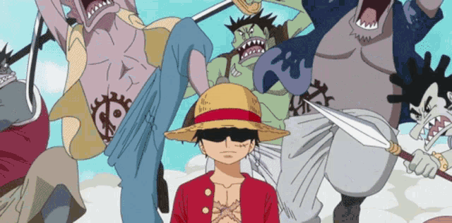 a man in a straw hat stands in front of a group of sharks