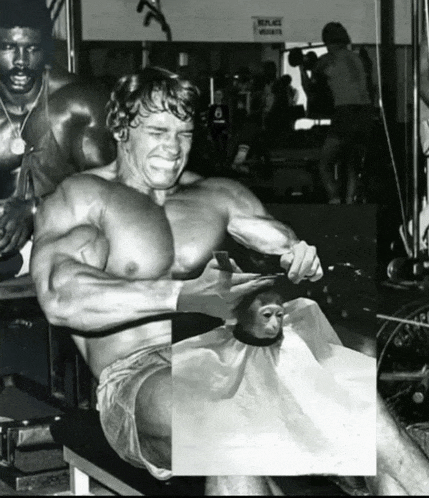 a black and white photo of a man cutting a monkey