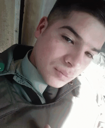 a close up of a man 's face with a jacket on