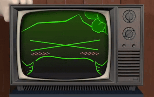 a television with a green screen and a drawing of a sad face
