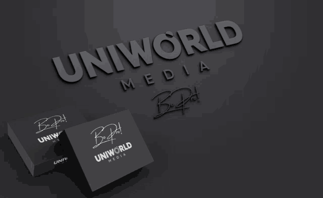 two business cards for uniworld media are on a black surface